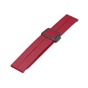 Detail view of red silicone watch strap with magnetic folding clasp for smart watch replacement.