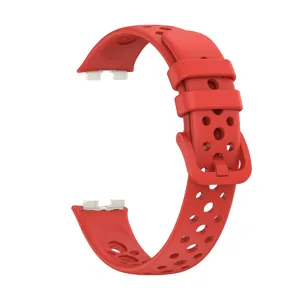 Red silicone breathable watch band detail, porous design for smart fitness tracker strap.