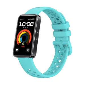 Breathable cyan silicone replacement strap for smart watch with perforated design.