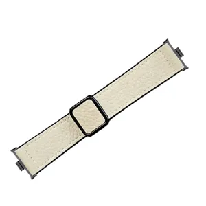 Beige litchi leather smartwatch strap detail with black metal connector and magnetic clasp.