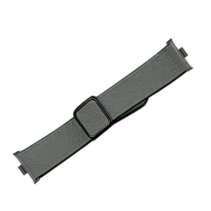 Close up view of grey litchi pattern magnetic leather watch strap with metal connector.