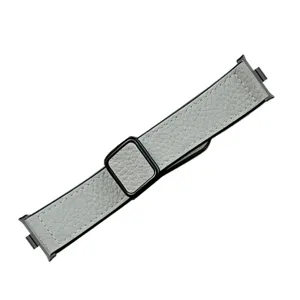 Gray litchi pattern leather watch strap detail, featuring black metal magnetic clasp.