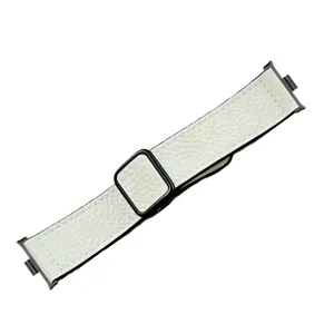 Detail shot of white litchi pattern leather smartwatch strap with metal connector and magnetic buckle.