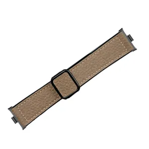 Close-up of brown lychee texture leather watch strap detail with black magnetic buckle.