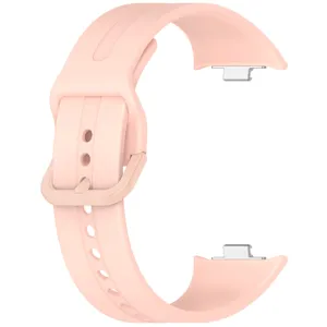 Close-up detail of the pink silicone replacement smartwatch strap with classic buckle.