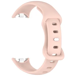 Detailed view of the light pink silicone replacement watch strap with metal connectors and buckle.