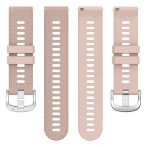Detail view of the pink silicone watch strap with breathable holes and silver buckle.