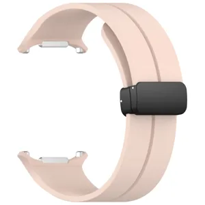 Detail view of the pink silicone smartwatch replacement strap with a black magnetic folding buckle.