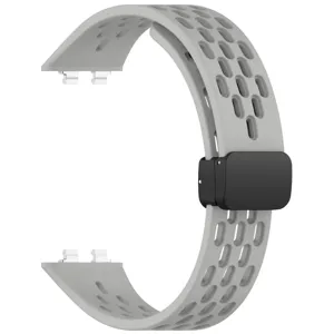 Silicone breathable perforated watch strap replacement with magnetic folding clasp detail.