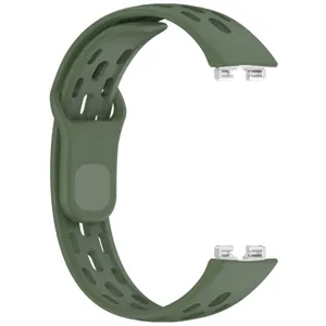Detailed view of green silicone breathable watch strap with metal connector and reverse buckle.