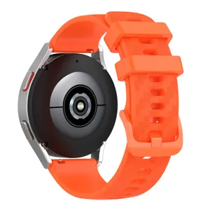 Orange silicone replacement watch strap with carbon fiber texture and matching buckle.