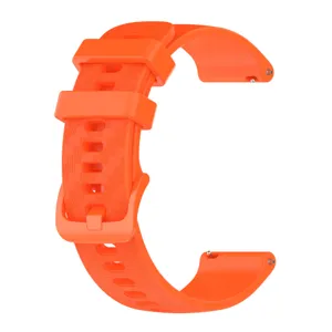 Orange silicone watch strap detail, carbon fiber texture surface, quick release pin design.