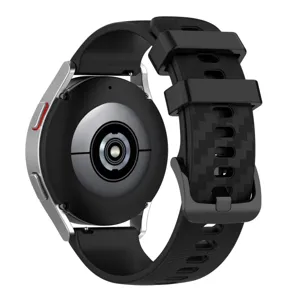 Detailed view of black silicone smartwatch strap with carbon texture and buckle design.