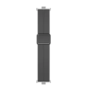 Close-up detail of the dark gray silicone watch strap with a square magnetic folding buckle.