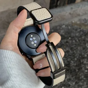 Leather magnetic folding clasp watch strap detail shot showing premium texture and sturdy metal buckle.