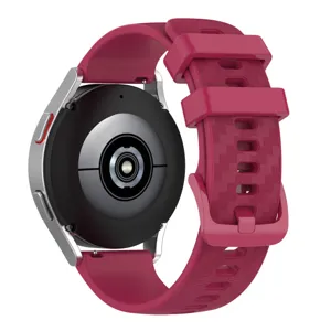 Silicone smartwatch strap with carbon fiber texture and matching buckle for replacement.