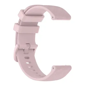 Pink silicone watch strap detail, textured carbon fiber design, quick release pins, 20mm.