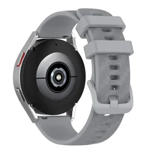Silicone smartwatch replacement strap with carbon fiber texture and matching buckle.