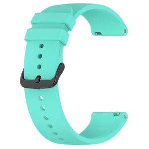 Detail view of turquoise silicone replacement watch band with black buckle and quick release pins.