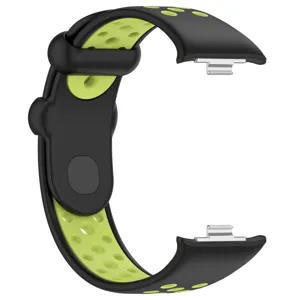 Gros plan du bracelet de sport de rechange perforé bicolore avec connecteur métallique.