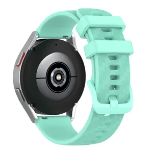 Silicone watch strap with textured geometric pattern and matching buckle in mint green color.
