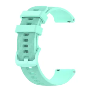 Mint green silicone watch strap close up view, featuring textured surface and buckle.
