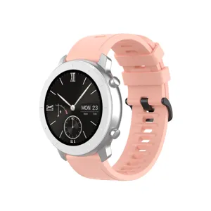 Smartwatch detail view showing the black dial with Roman numerals and pink strap.