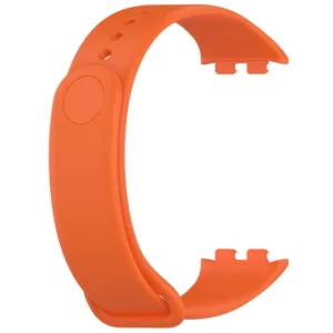 Orange silicone replacement watch band detail view, flexible material and secure buckle clasp.