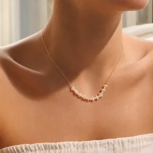Elegant 18k gold steel chain necklace with natural shell disk beads and pearls for women.