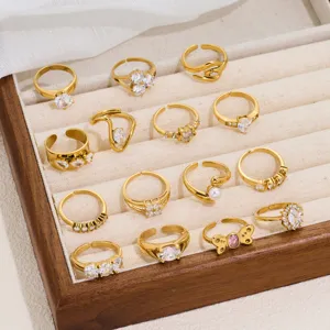 Detailed view of fashionable 18K gold plated open rings set with sparkling cubic zirconia.