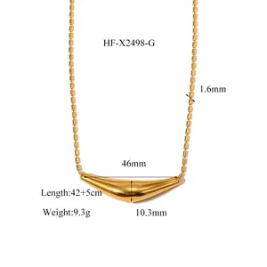 Gold titanium steel geometric arc pendant necklace with delicate beaded chain details.