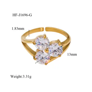 Detail close-up of the elegant 18K gold plated triple cubic zirconia open ring design.