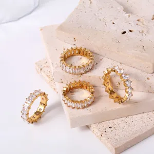 Gold stainless steel geometric zircon rings detail display, elegant stacking luxury jewelry design.