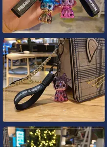 Electroplated colorful deer keychain bag pendant with black strap and metal chain details.