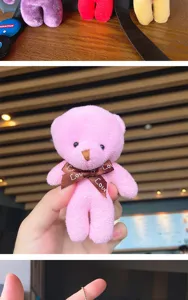 Detailed close-up shot of the cute plush bear pendant, showing soft texture and bow ribbon.