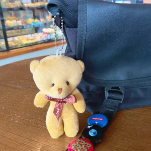 Cute plush bear keychain, soft stuffed animal doll bag charm for backpack or keys.