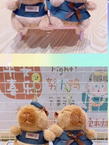 Cute capybara plush toy keychain with denim clothes, soft stuffed animal bag charm accessory.