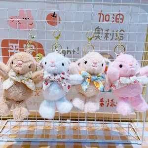 Portachiavi con coniglietto di peluche carino e fiocco floreale, morbido ciondolo per borse.