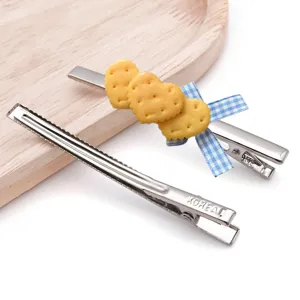 Metal duckbill hair clips with cute heart biscuit charms and blue bow, DIY hair accessories.