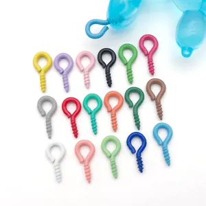 Closeup view of colorful metal screw eyes, perfect DIY jewelry making accessories for pendants.