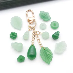 Green glass DIY jewelry charms pendant accessories set with metal keychain and leaf shapes.