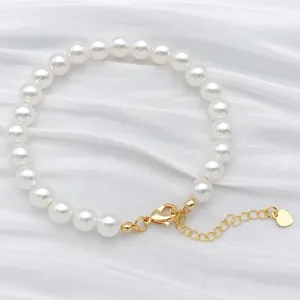 Pulsera de perlas blancas sinteticas con cierre dorado y cadena de extension elegante accesorio