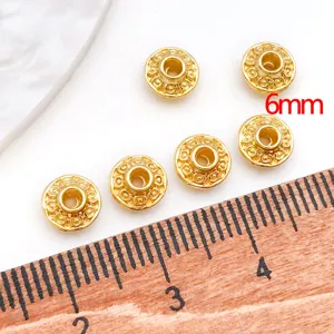 Gold plated UFO metal spacer beads detail shot, 6mm DIY jewelry making loose beads accessory.
