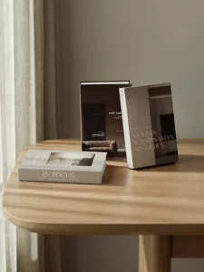 Detailed view of Scandinavian wabi-sabi decorative books, elegant home decor staging prop.