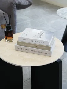 Detail shot of decorative fake book stack with modern minimalist design for interior decor.