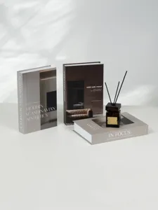 Minimalist decorative fake books set with diffuser for modern nordic home interior decor detail.