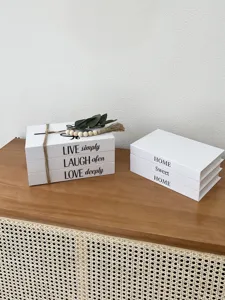 Decorative fake book storage box set with rustic typography for modern home office desk decor.