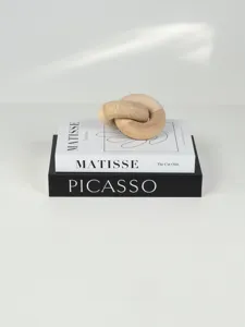 Nordic minimalist decorative storage book and wooden knot decor set for modern home aesthetic.