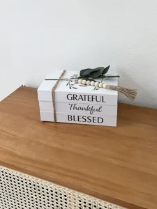 Decorative fake book box set with rustic typography, perfect home decor storage solution.