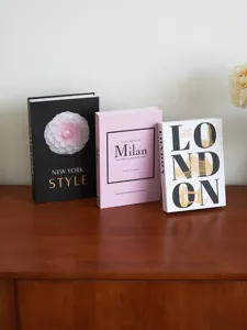 Decorative fake book set detail showing modern city aesthetic designs for coffee table display.